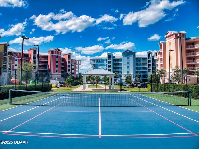 view of tennis court with a gazebo