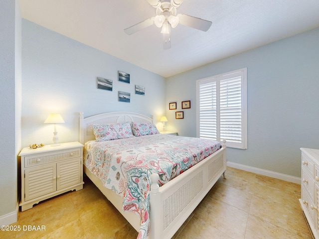 tiled bedroom featuring ceiling fan