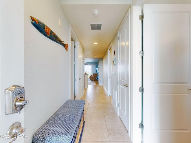 corridor with light tile patterned floors