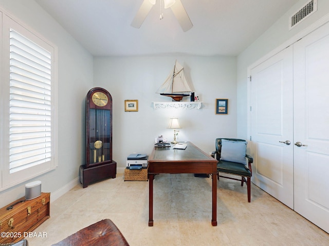 office area with ceiling fan and light tile patterned flooring