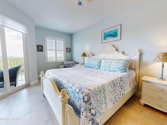 bedroom featuring access to exterior and light tile patterned floors