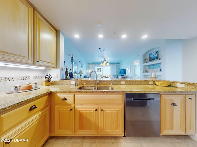 kitchen with dishwasher, light brown cabinets, sink, light stone counters, and light tile patterned floors