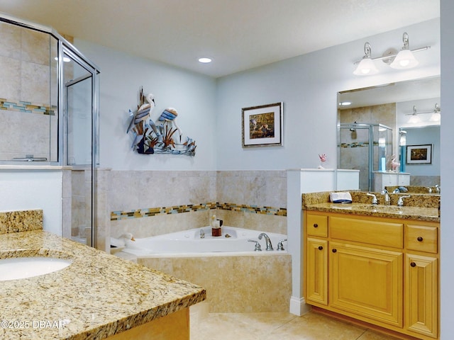 bathroom featuring tile patterned floors, vanity, and plus walk in shower