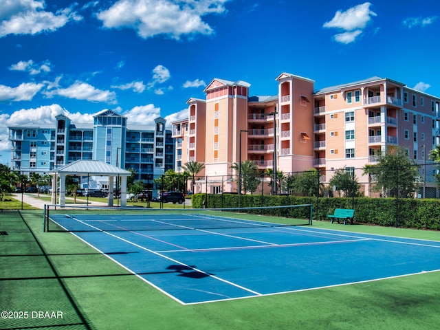 view of tennis court with a gazebo and basketball court