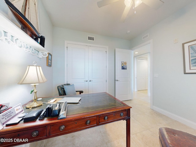 tiled home office with ceiling fan