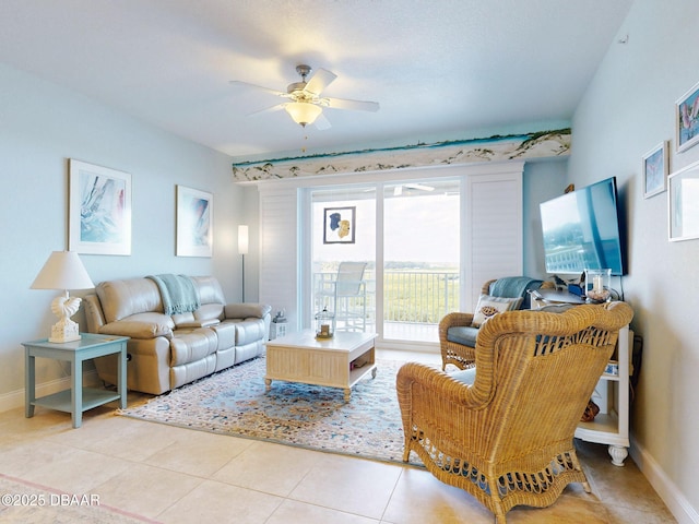 living room with ceiling fan and light tile patterned flooring