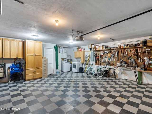 garage featuring washing machine and clothes dryer and a garage door opener