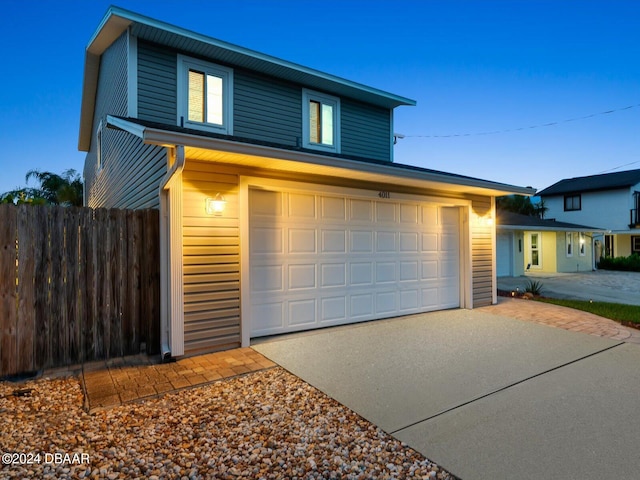 view of front of property with a garage