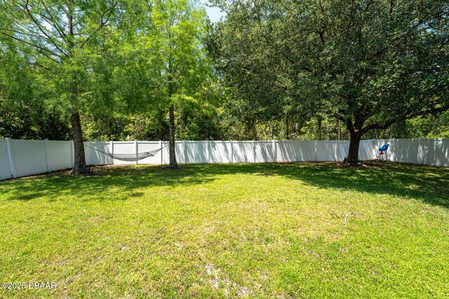 5 Zammer Ct, Palm Coast, FL 32164 - view of yard with a fenced backyard