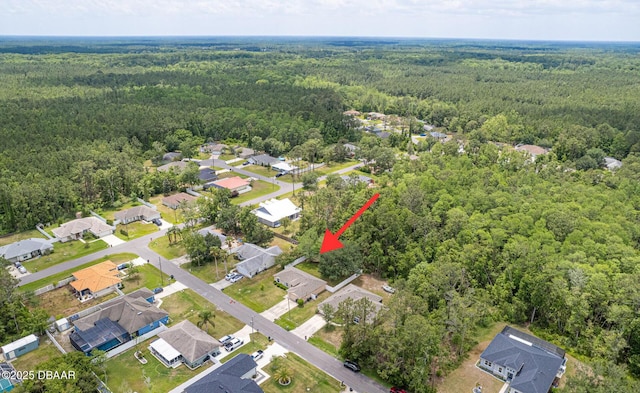 5 Zammer Ct, Palm Coast, FL 32164 - bird's eye view featuring a residential view and a wooded view