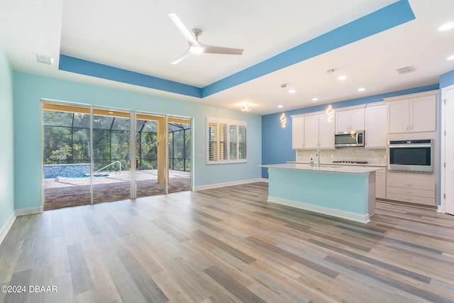 300 Blue Starfish Pl, Daytona Beach, FL 32124 - kitchen with appliances with stainless steel finishes, ceiling fan, decorative backsplash, recessed lighting, and baseboards