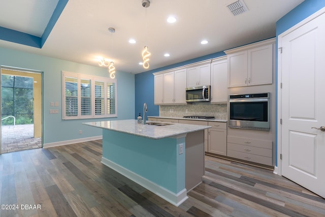 300 Blue Starfish Pl, Daytona Beach, FL 32124 - kitchen featuring appliances with stainless steel finishes, recessed lighting, plenty of natural light, tasteful backsplash, and dark wood-style flooring
