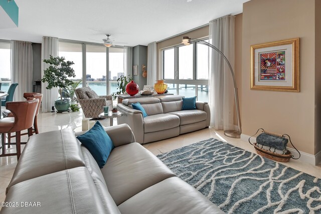 231 Riverside Dr Unit 901, Holly Hill, FL 32117 - living room with a ceiling fan and baseboards