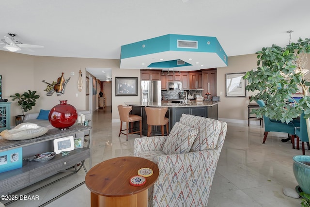 231 Riverside Dr Unit 901, Holly Hill, FL 32117 - living room featuring a ceiling fan, baseboards, and recessed lighting