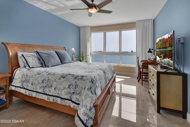 231 Riverside Dr Unit 901, Holly Hill, FL 32117 - bedroom with baseboards and a ceiling fan