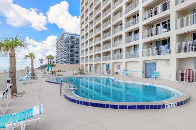 view of pool featuring a patio area