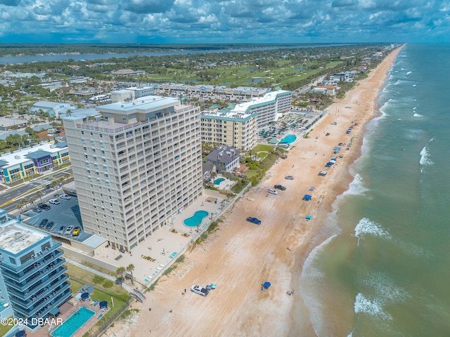 bird's eye view with a water view and a view of the beach