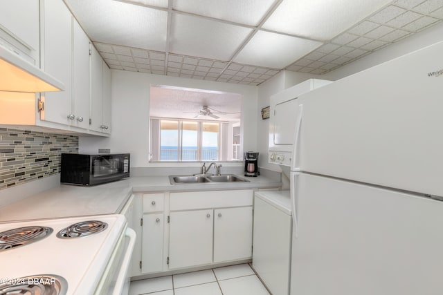 kitchen with light tile patterned flooring, sink, ceiling fan, white appliances, and white cabinets