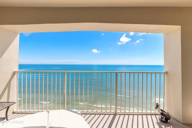 balcony with a view of the beach and a water view