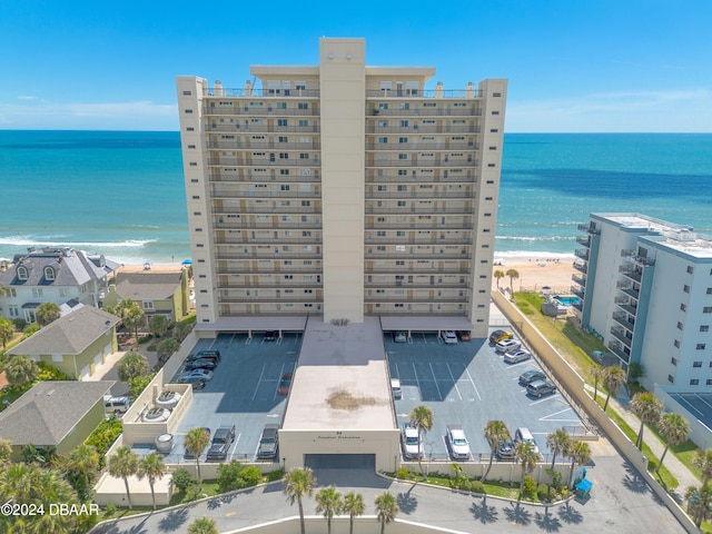 drone / aerial view featuring a view of the beach and a water view