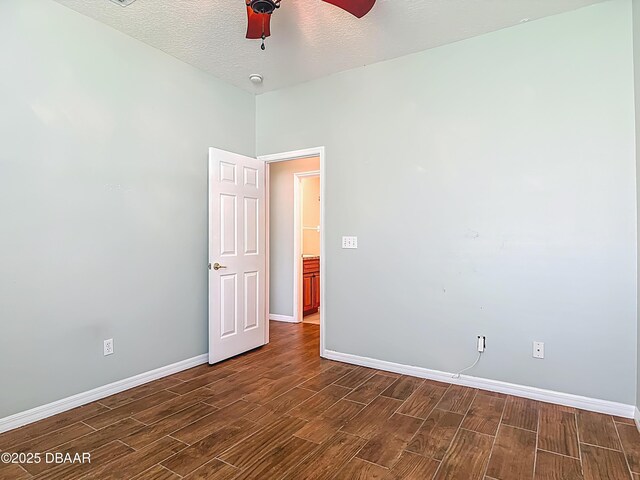 189 Perfect Dr, Daytona Beach, FL 32124 - unfurnished room featuring wood finish floors, a ceiling fan, and a textured ceiling