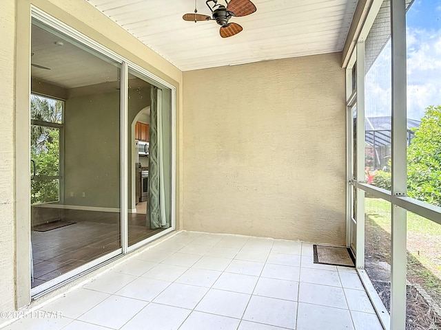 189 Perfect Dr, Daytona Beach, FL 32124 - unfurnished sunroom with a ceiling fan and arched walkways