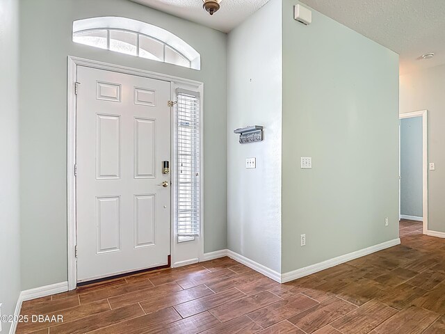 189 Perfect Dr, Daytona Beach, FL 32124 - entryway featuring wood finish floors and baseboards