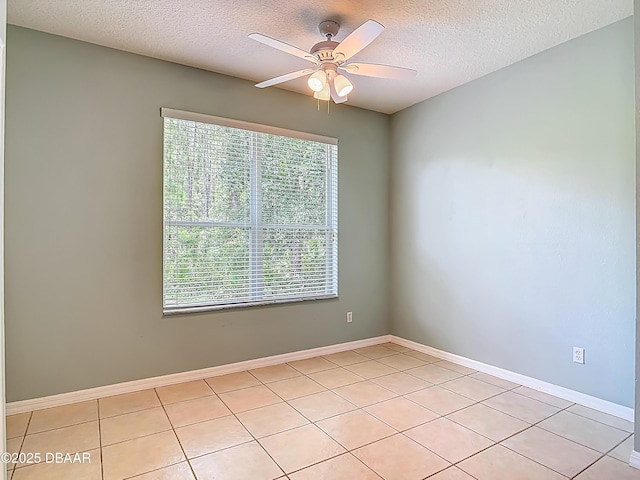 189 Perfect Dr, Daytona Beach, FL 32124 - unfurnished room with plenty of natural light, a textured ceiling, ceiling fan, and light tile patterned floors
