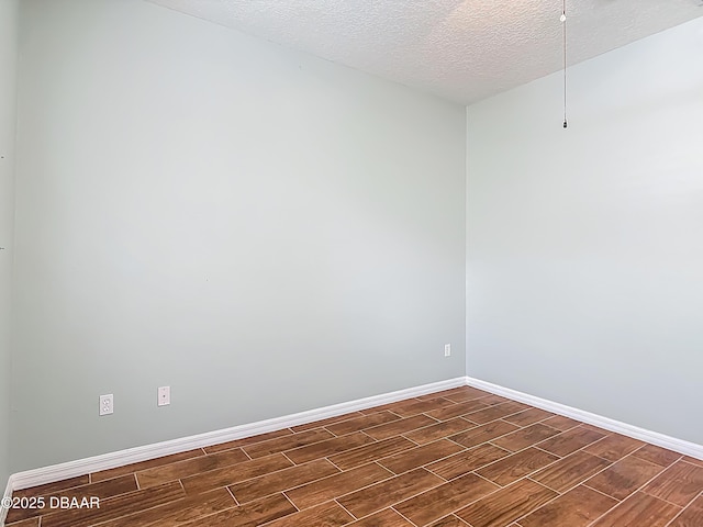 189 Perfect Dr, Daytona Beach, FL 32124 - spare room with wood finish floors and a textured ceiling