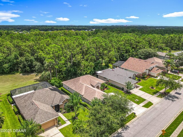 189 Perfect Dr, Daytona Beach, FL 32124 - aerial view of residential area featuring a heavily wooded area