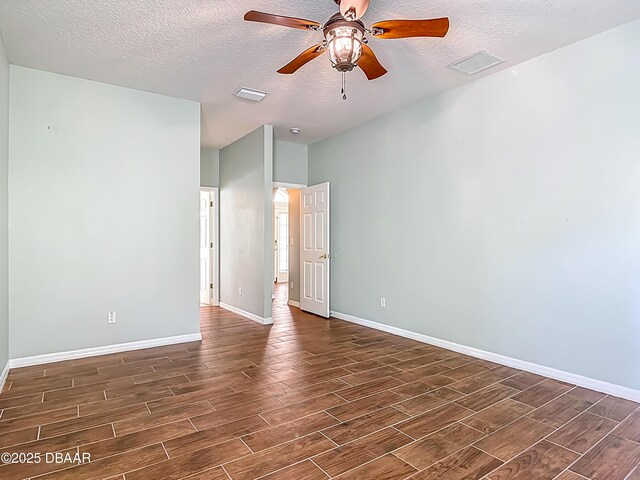 189 Perfect Dr, Daytona Beach, FL 32124 - empty room featuring wood finish floors, a textured ceiling, and ceiling fan