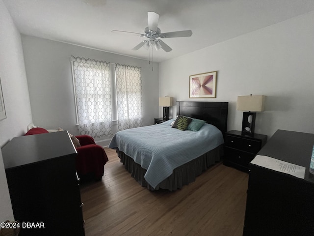 bedroom featuring ceiling fan and dark hardwood / wood-style flooring