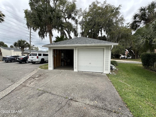 garage featuring a yard