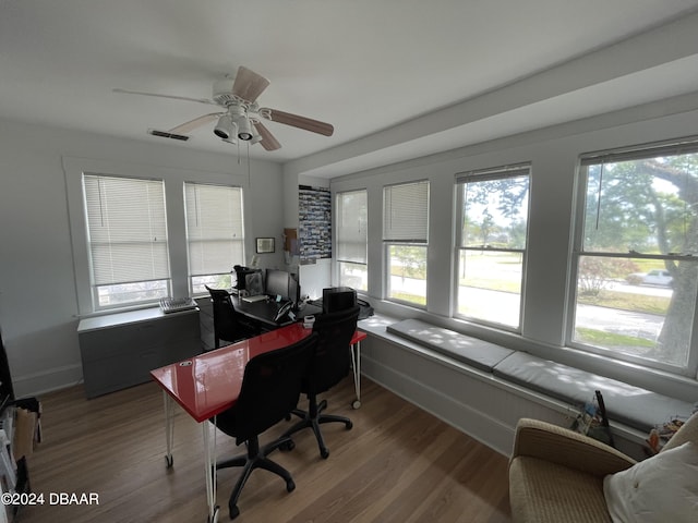 home office featuring hardwood / wood-style floors, a healthy amount of sunlight, and ceiling fan