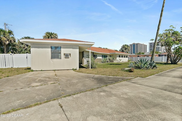 exterior space featuring a gate, a front yard, and fence