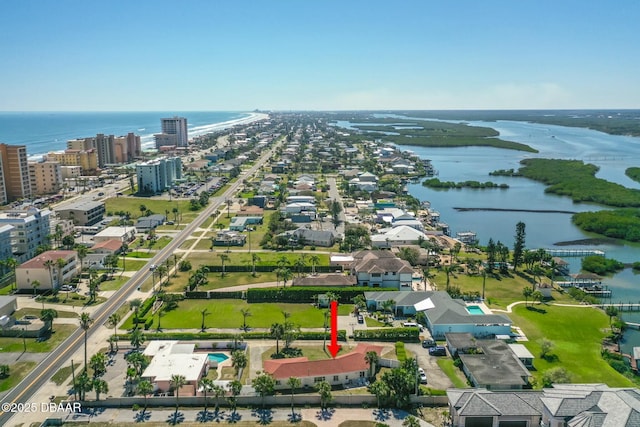 bird's eye view featuring a city view and a water view