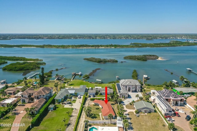 birds eye view of property featuring a residential view and a water view