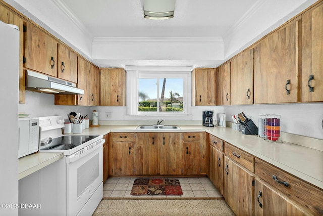 kitchen with crown molding, under cabinet range hood, light countertops, white appliances, and a sink