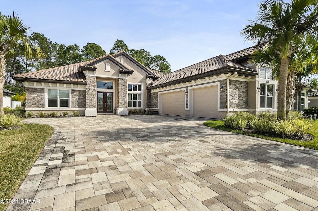 view of front facade with french doors and a garage