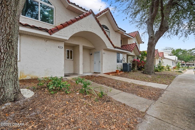 mediterranean / spanish house with central AC unit