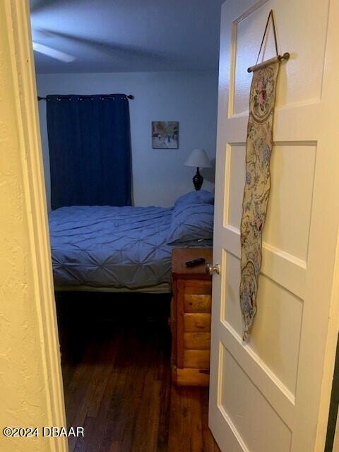 bedroom featuring wood finished floors