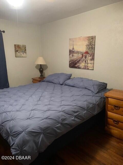 bedroom with wood finished floors