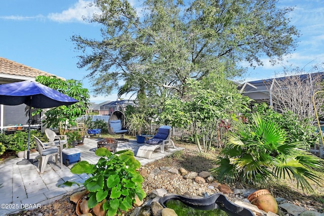 view of patio with a fire pit