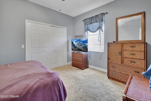 carpeted bedroom with a closet