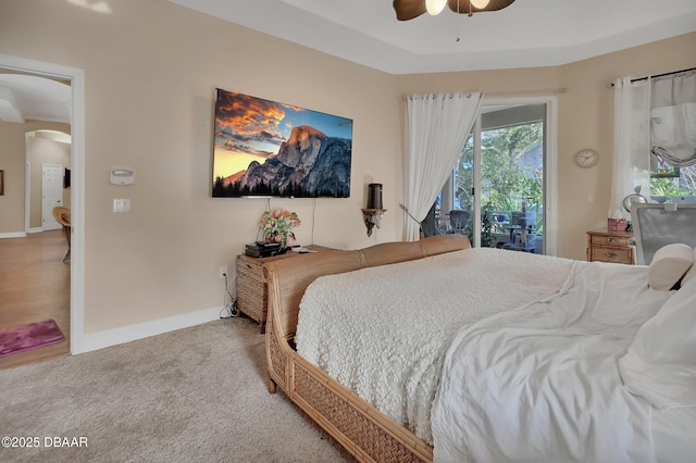 carpeted bedroom with access to outside and ceiling fan