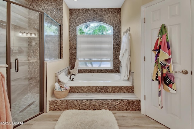 bathroom featuring plus walk in shower