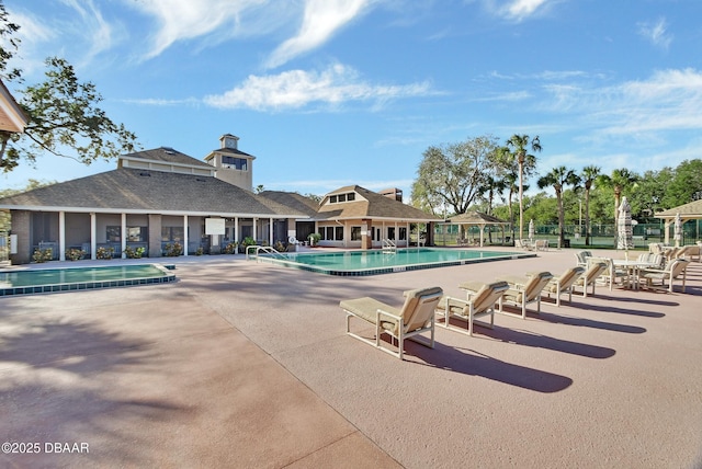 view of swimming pool featuring a patio area