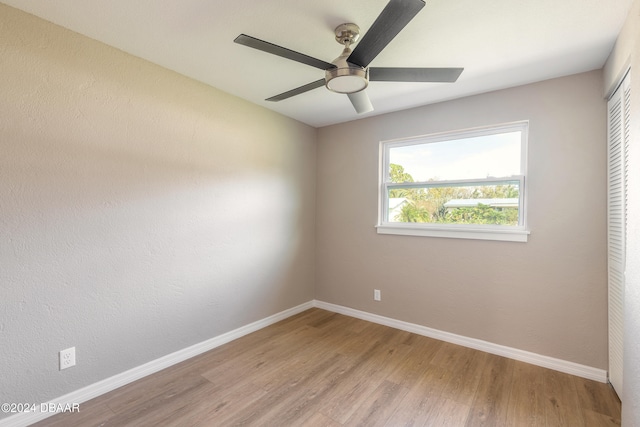 unfurnished room with light hardwood / wood-style floors and ceiling fan