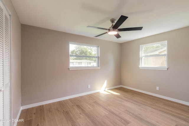 unfurnished room featuring light hardwood / wood-style floors and ceiling fan