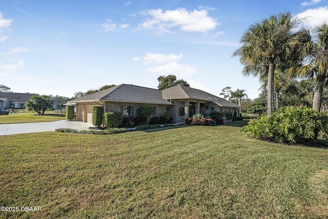 ranch-style home featuring a front lawn and a garage